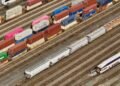 Freight train moving containers through a commercial transit terminal in Turkey logistics hub.