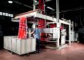 Textile manufacturing equipment processing raw material inside a modern industrial facility in Turkey.