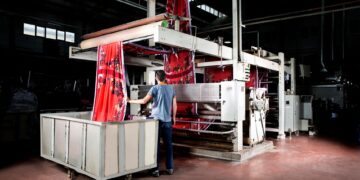 Textile manufacturing equipment processing raw material inside a modern industrial facility in Turkey.
